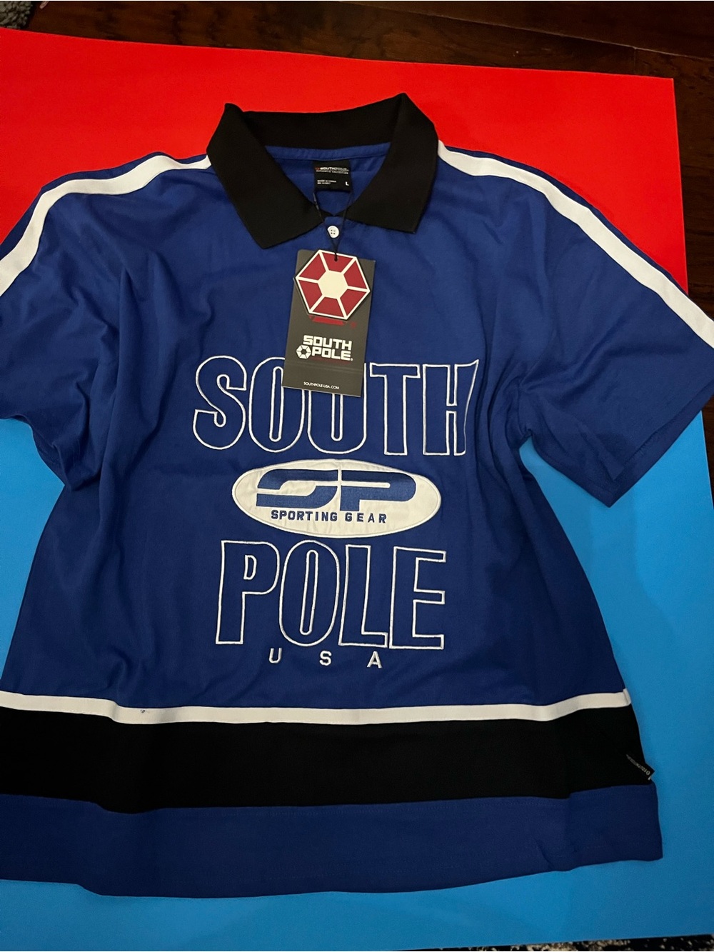 South Pole Blue Polo with Black Collar and Graphic Tag Men or Women